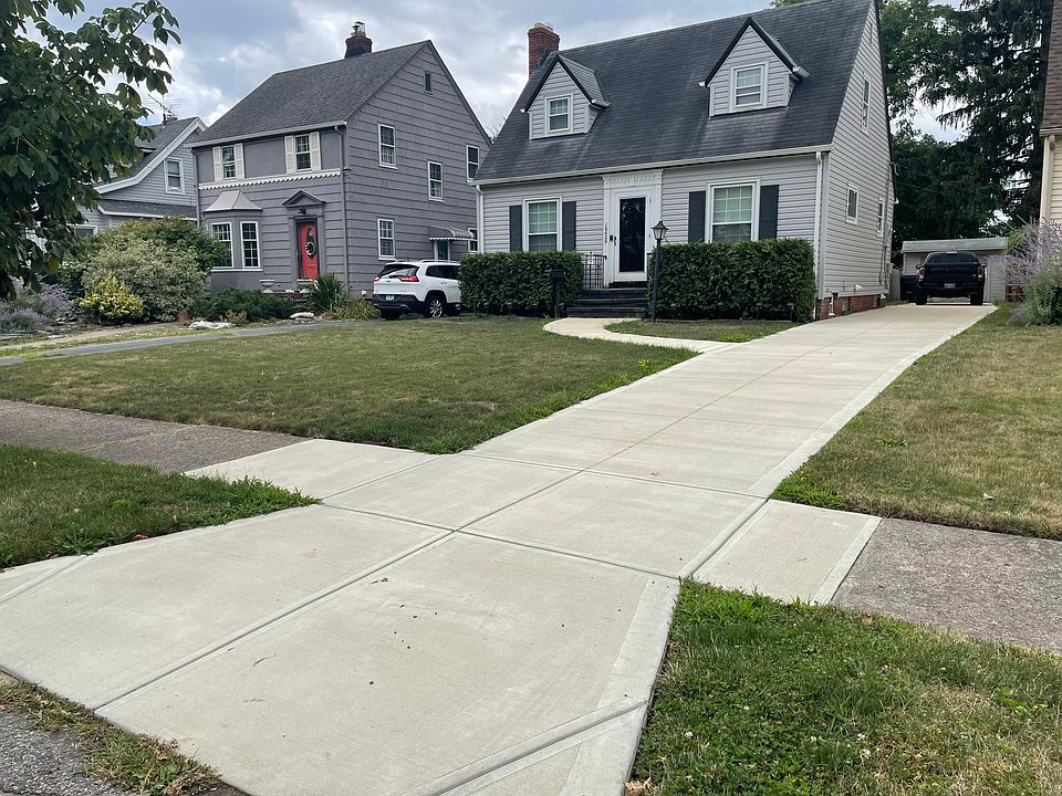 New concrete driveway with sewer in rear