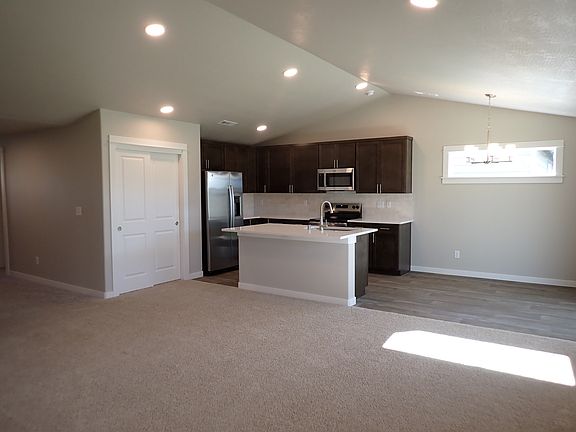 Warm kitchen with eating counter and near new appliances