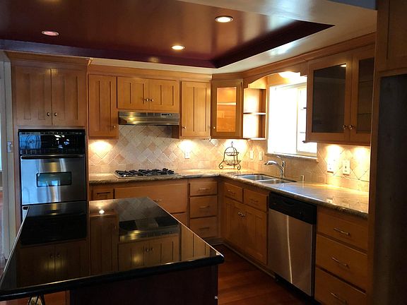 updated kitchen, granite countertops, travertine backsplash,