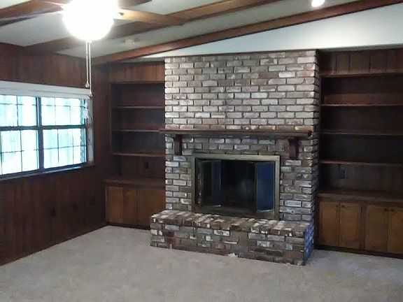 Family Room with Vaulted Ceiling, Brick Fireplace, built-in