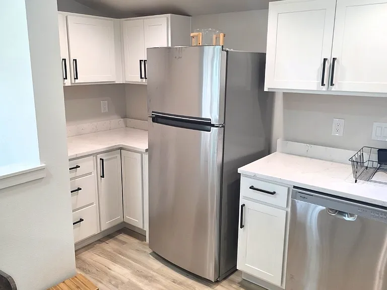 Full size stainless appliances and lots of storage space with full kitchen furnishings.