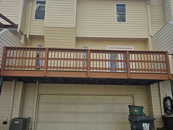 Drive-under 2-car garage townhome with a freshly updated exterior and private entry_nestled in sought-after Sandy Springs.