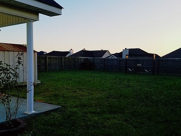 Patio, storage shed, swing 