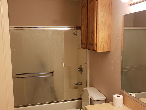 Full upstairs bathroom with bathtub shower.