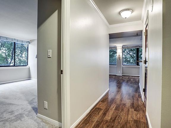 Enter the unit to fresh paint, beautiful hardwood floors, and the secondary bedroom to the left. To the right is the full secondary bathroom.
