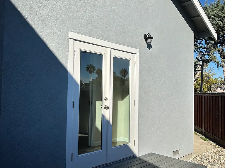 French door, deck area, separate entrance/exit to Bedroom 1