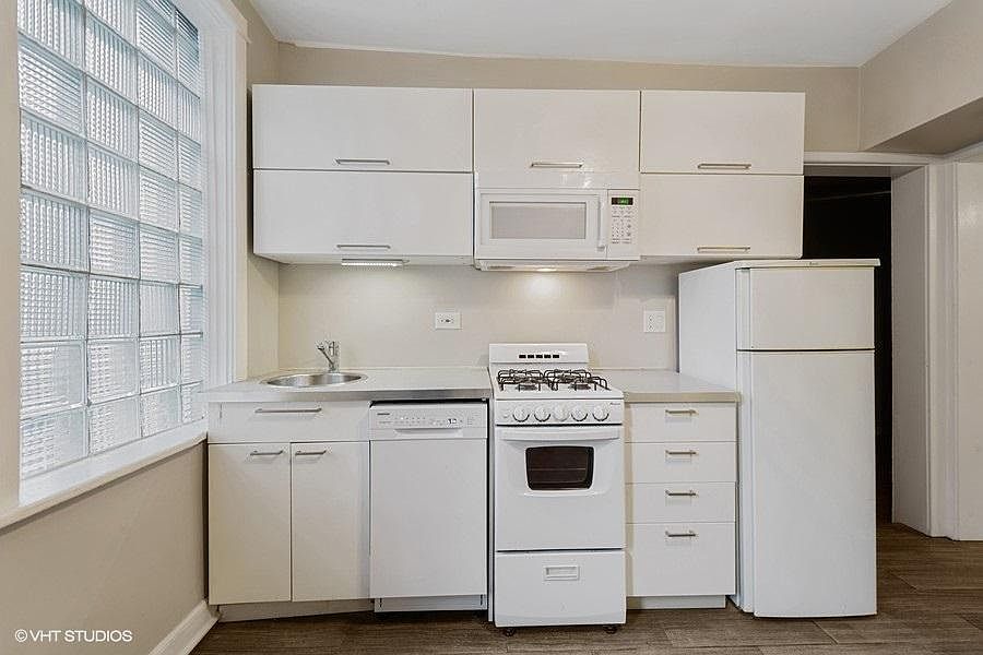 White on white kitchen with dishwasher & microwave