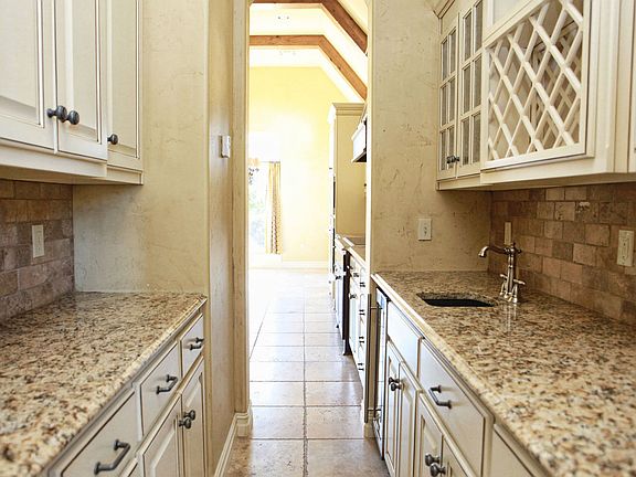 Butler's Way features granite, wine cabinet, sink