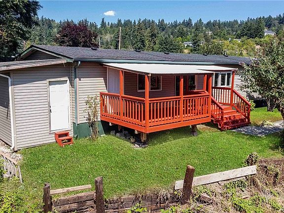 Covered Deck with Railing & Shed for Additional Storage Space.