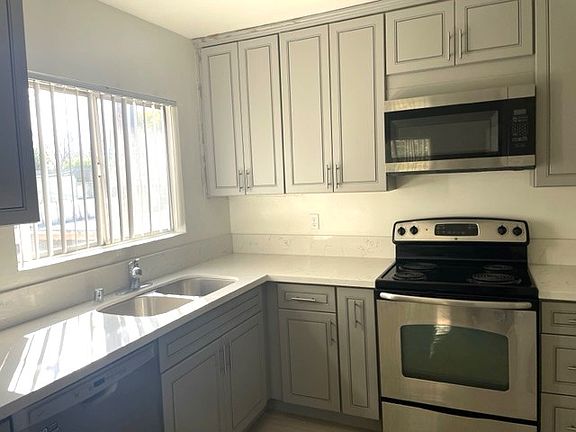 Kitchen with lots of light; built-in microwave