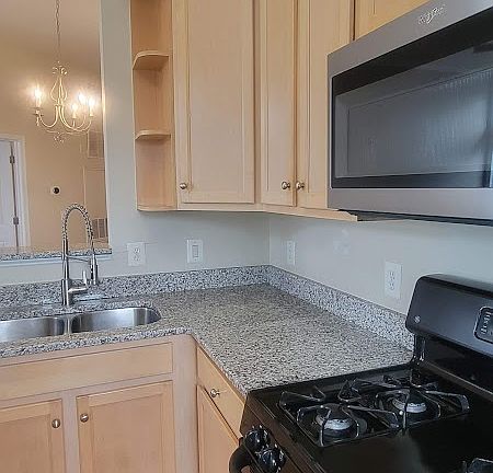 Kitchen has plenty of counter space and a lot of cabinets