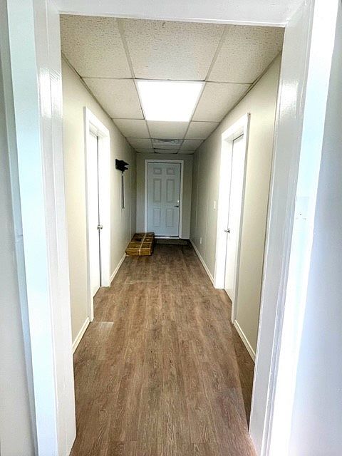 Central hallway with secured private entrances for each unit