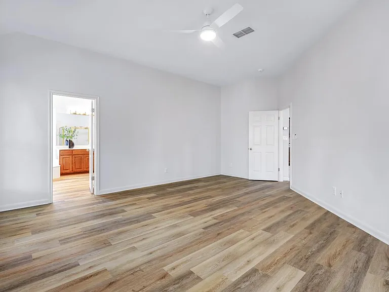 Another view of the primary bedroom