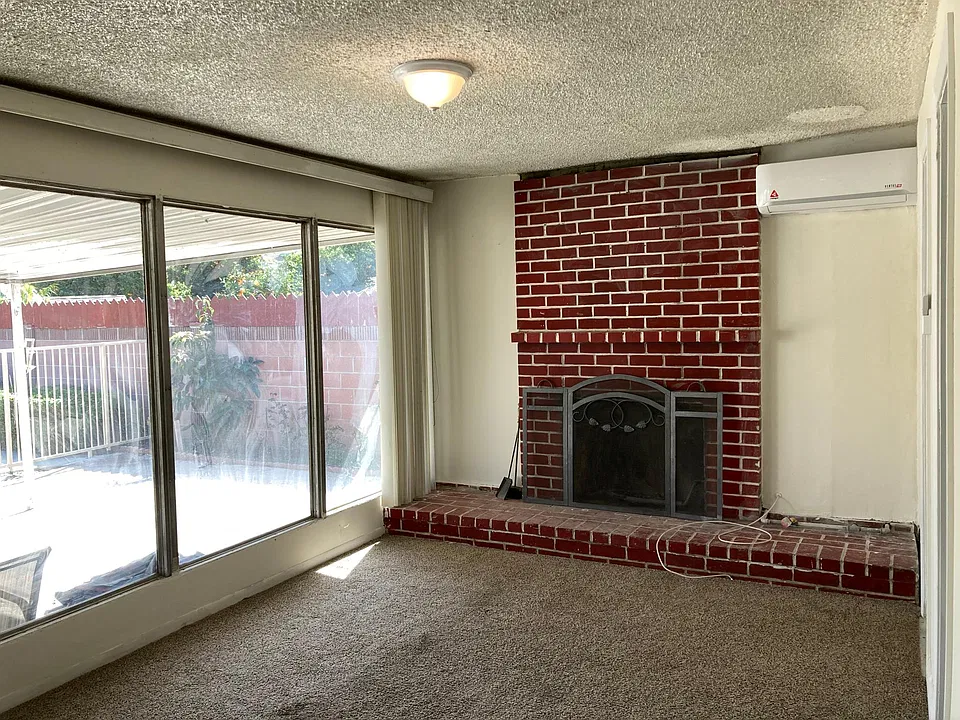 Master bedroom opens up to sunny backyard