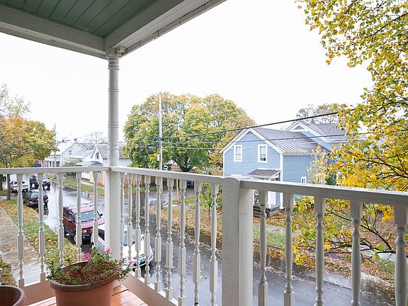 view over leafy and quiet Pitkin Street from the private front porch