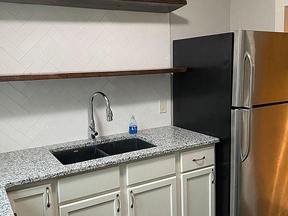 kitchen door by fridge leads to diningroom