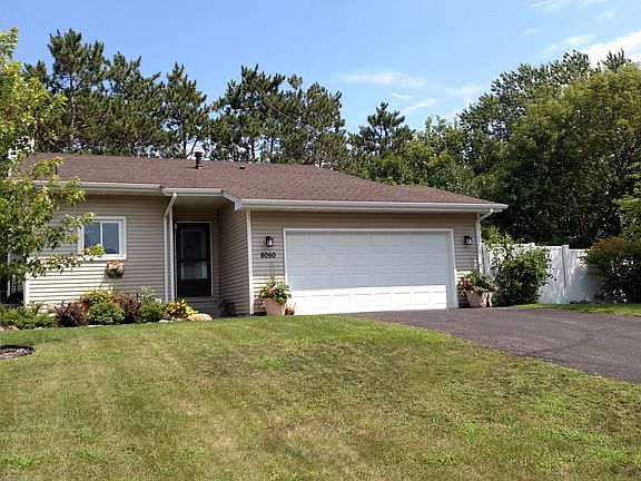 Lush landscaping invites you