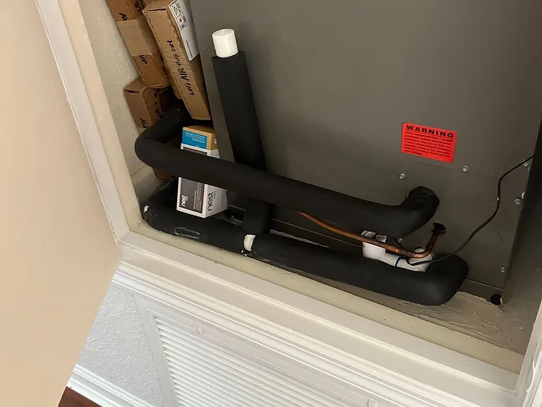 70 - HVAC system access and air handler unit.