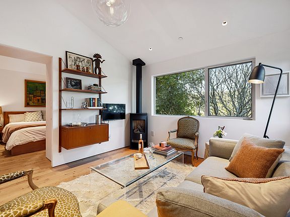 Public space with upstairs queen bedroom.
