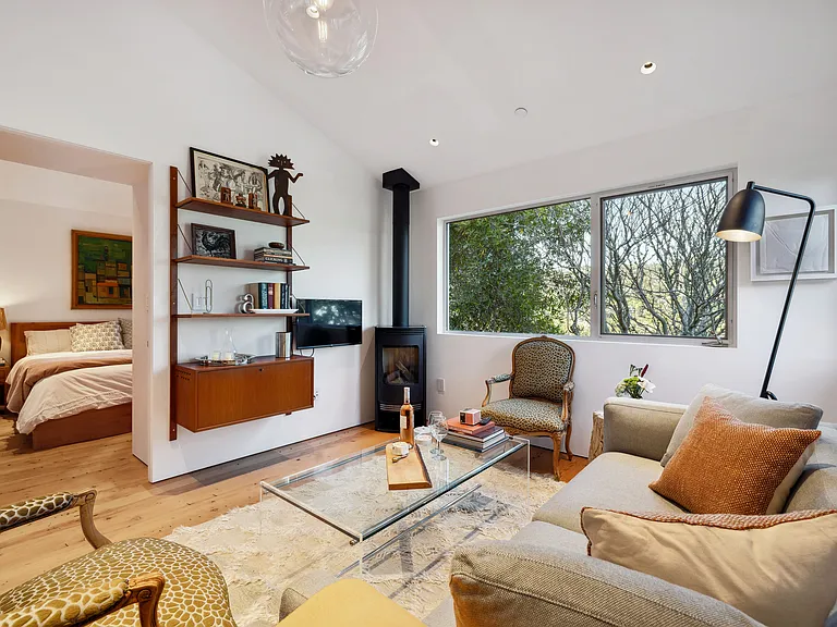 Public space with upstairs queen bedroom.