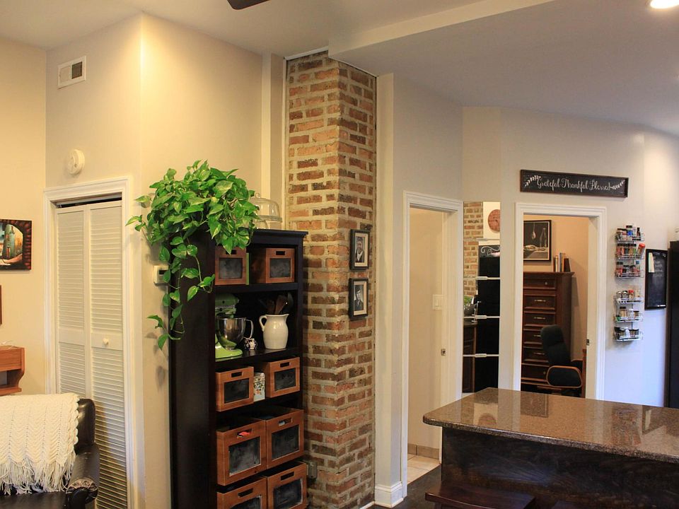 living room and furnace in closet