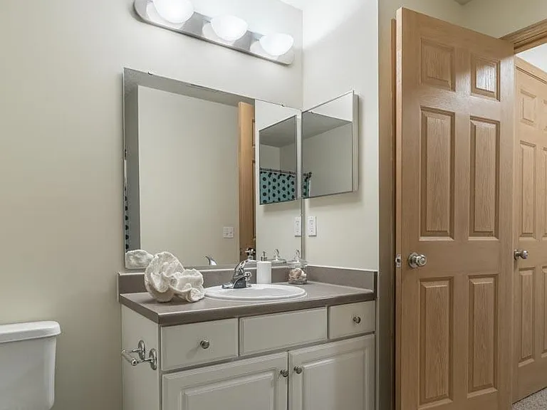 A well-lit bathroom vanity space makes getting ready for the day simple and enjoyable.