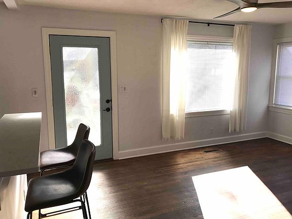 Living room looking toward front entry plus breakfast bar