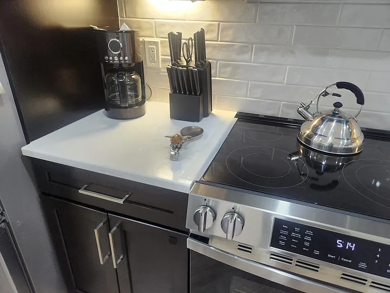 New convection oven with built in in air fryer also new quartz countertops.