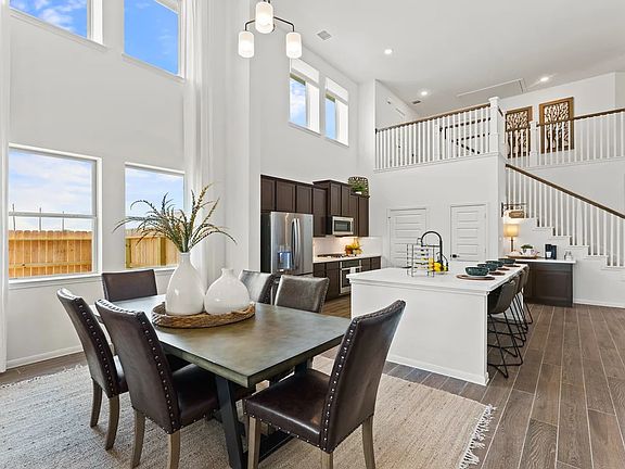 Dining area with two story ceiling