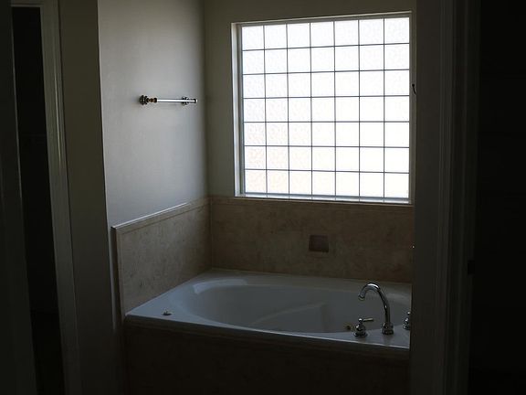 Master Bathroom features whirlpool tub and shower, & his/her