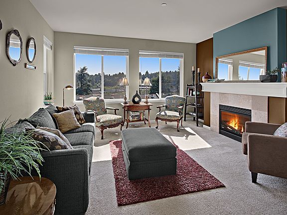 Living Room with sweeping views, gas fireplace, and lots of light.