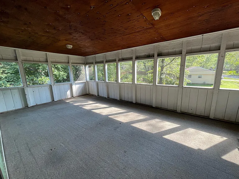 Large screened in porch, leads to a deck