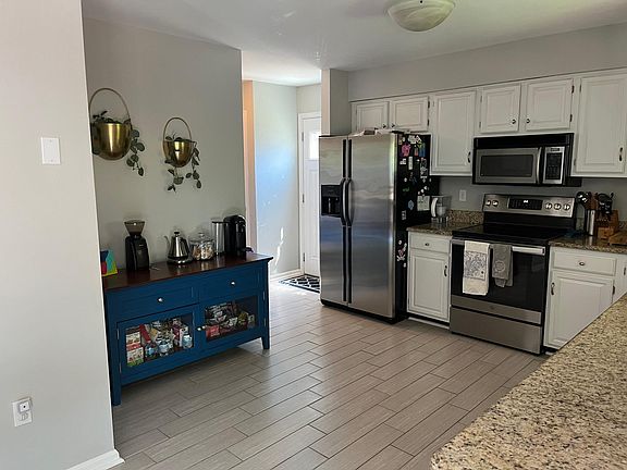 Kitchen, and view of the side door to driveway.
