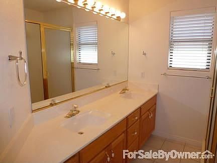 Front room
						:
						View of the front room and bay windows.