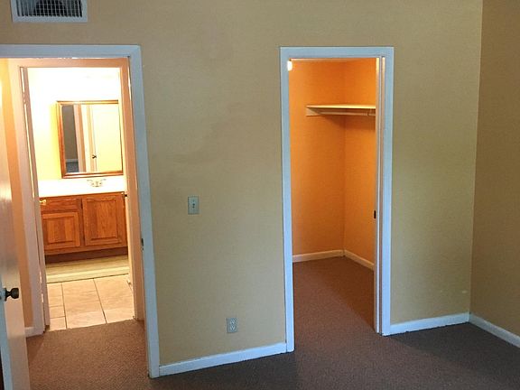 Master bedroom walk in closet with access to bathroom