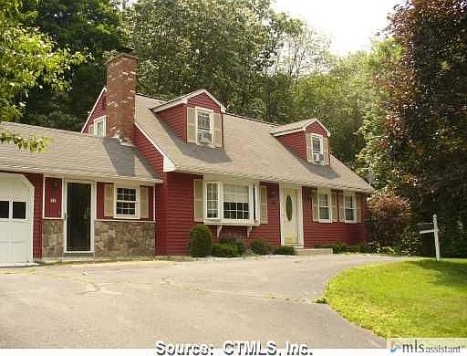 House has semi-circle drive way.