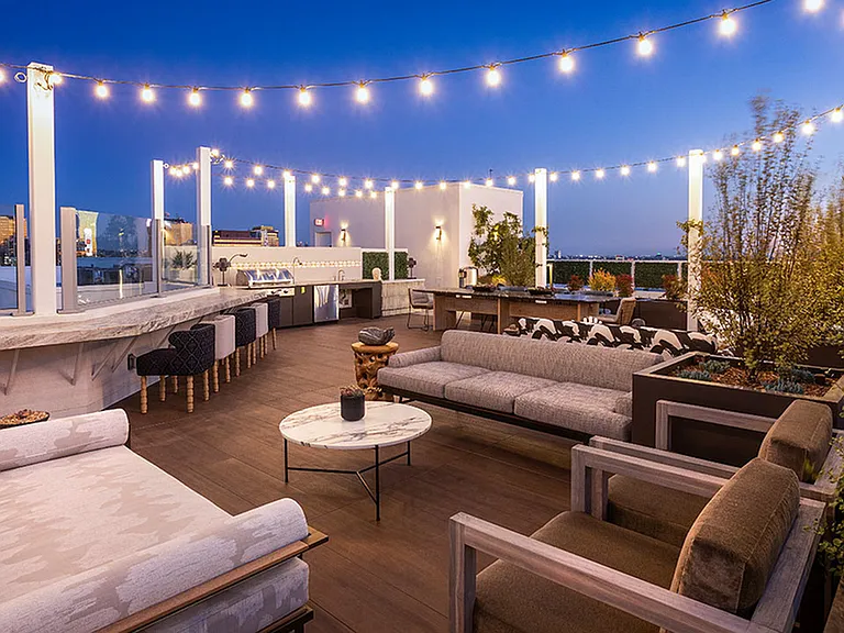 Gorgeous outdoor lounge area with grilling stations and alfresco dining