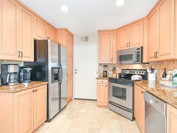 Kitchen with entry door from garage
