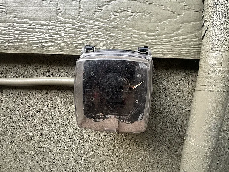 30 amp RV/EV plug behind gate on west side of house