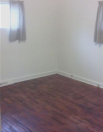 Bedroom with mirror closet doors