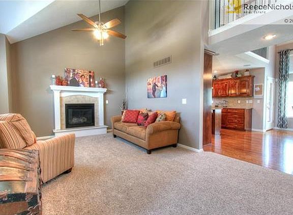 Spacious great room with vaulted ceiling and fireplace