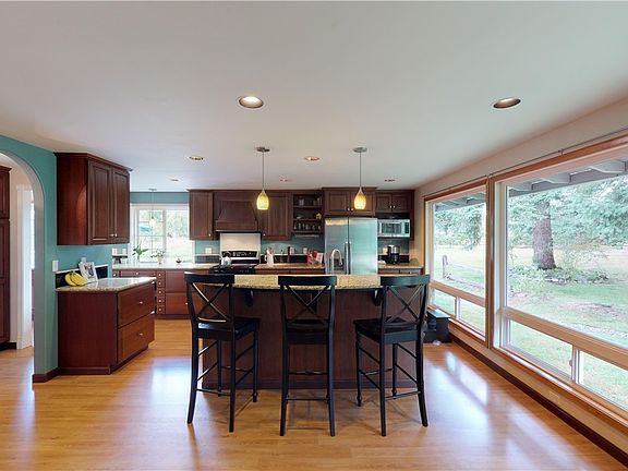 The Kitchen has plenty of cabinet space and granite countertops.