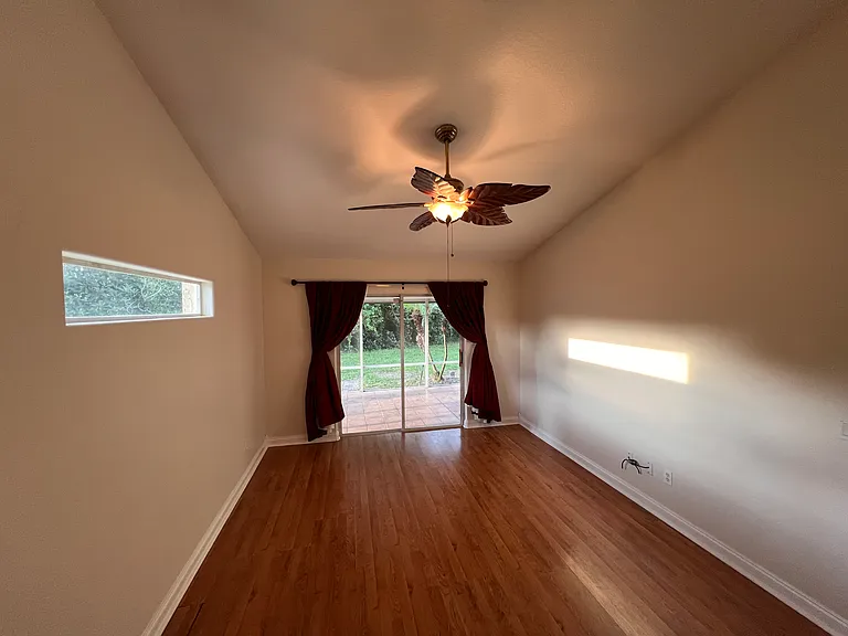 main bedroom with vaulted ceiling
