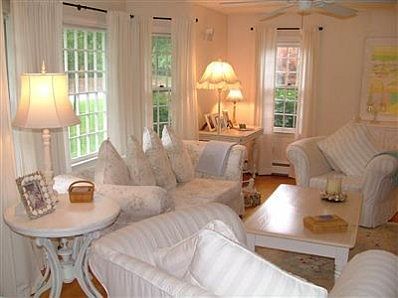 Living room view from the foyer out to the home's front bay window.