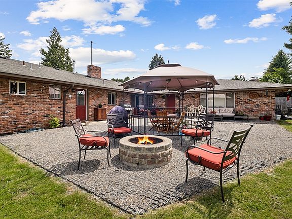 Spacious outdoor entertainment area with firepit.