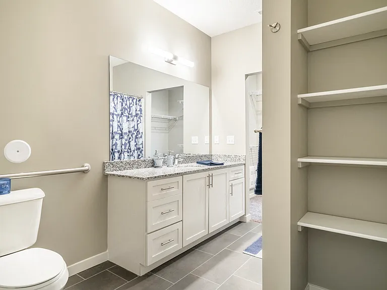 Our bathrooms include spacious vanities with ample storage, perfect for keeping your essentials organized.