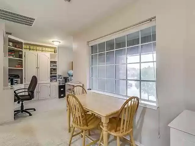 Study nook with built-in cabinets up stairs