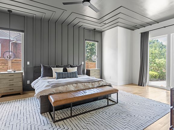 Luxurious first-floor master suite with a king bed, private en-suite bathroom, spacious walk-in closet, and in-suite washer and dryer_your own private retreat with comfort and convenience.