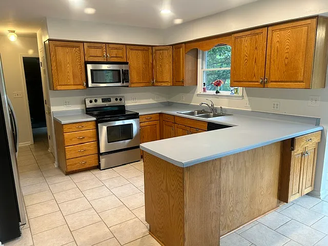 Bright and functional kitchen with stainless steel appliances