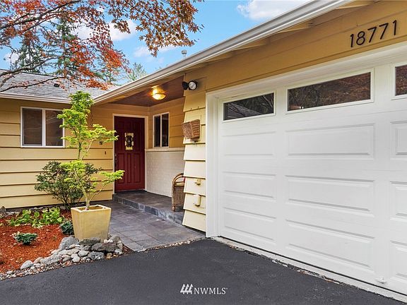 Warm and enticing front entry with patio space.